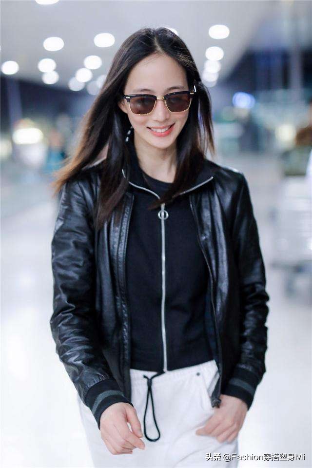 张钧甯皮衣机场照 (张钧甯身穿黑色皮衣)