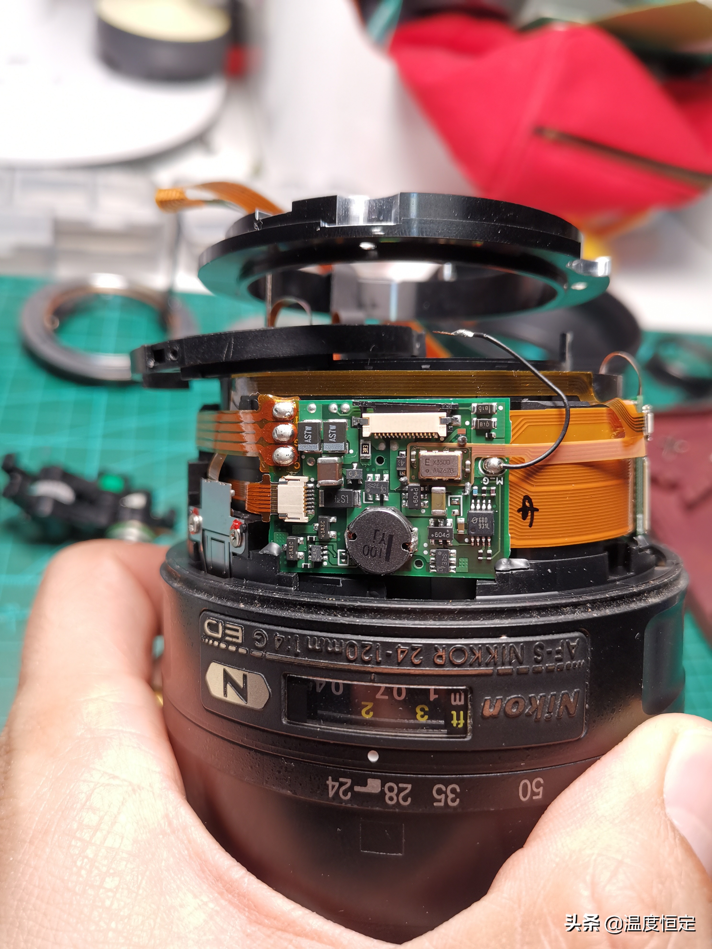 尼康镜头防抖打开一直响,尼康24-120镜头防抖怎么开