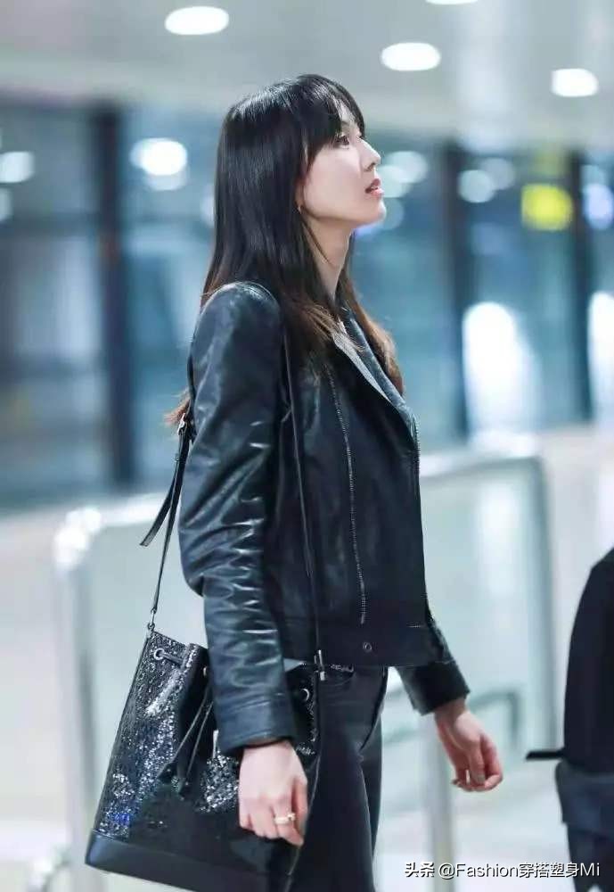 张钧甯皮衣机场照 (张钧甯身穿黑色皮衣)