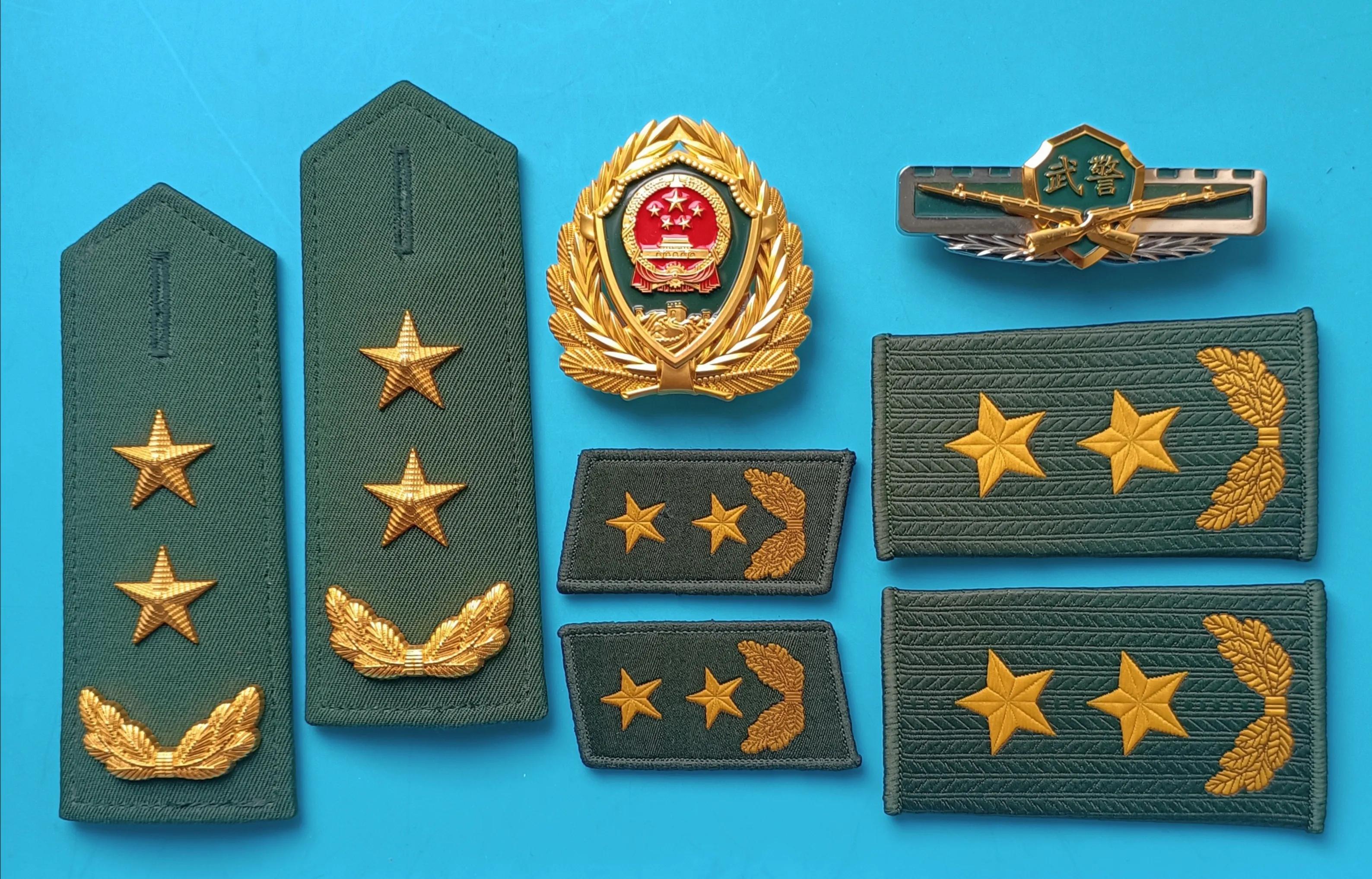 毛启国军装,毛启国警用帽徽